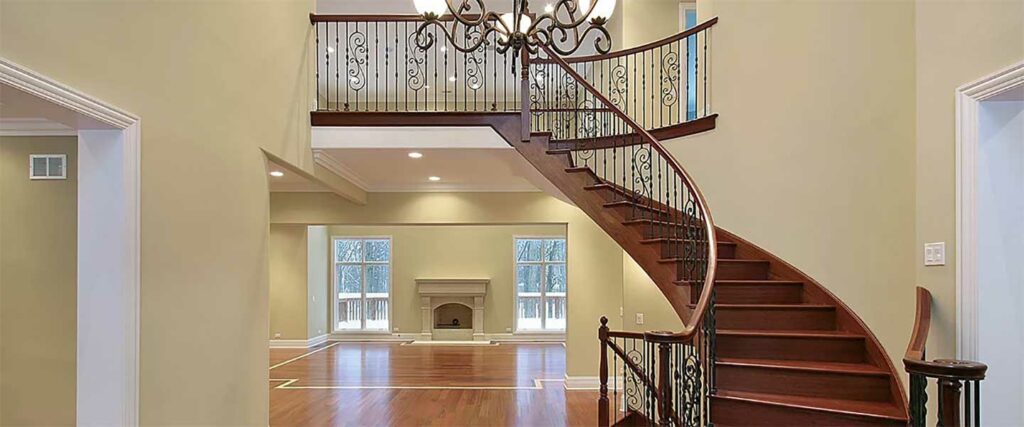 Foyer with balcony and curved staircase